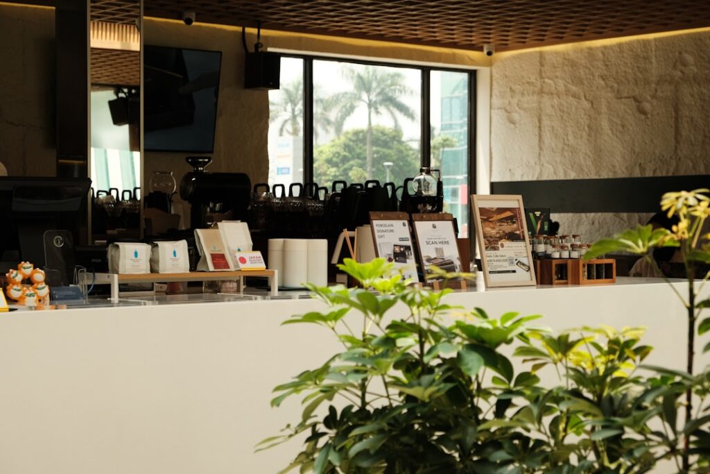 Pret CEO Reveals What Today's Consumer Really Values Modern cafe interior with counter and plants