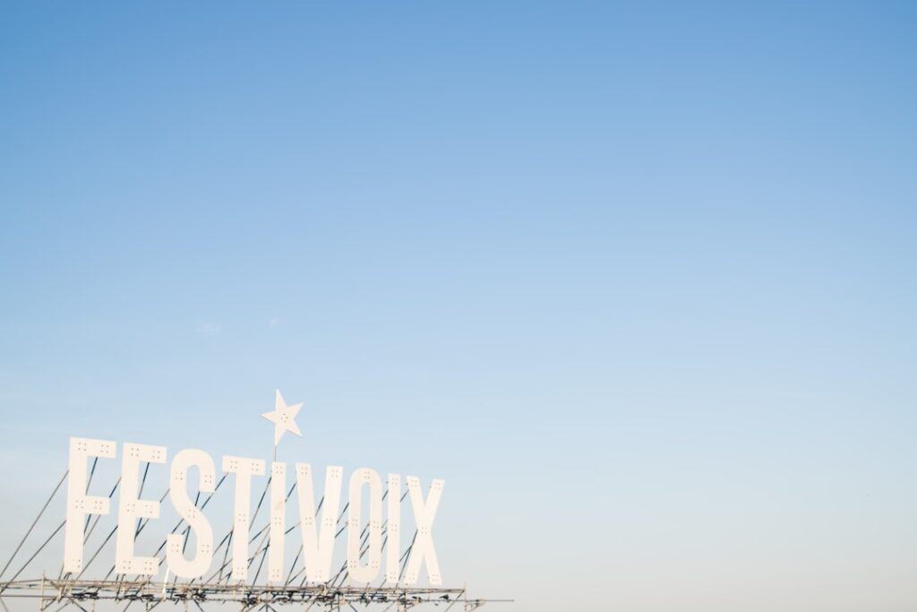 Red Rooster Festival Cancelled Over Funding Shortage white Festivoix signage