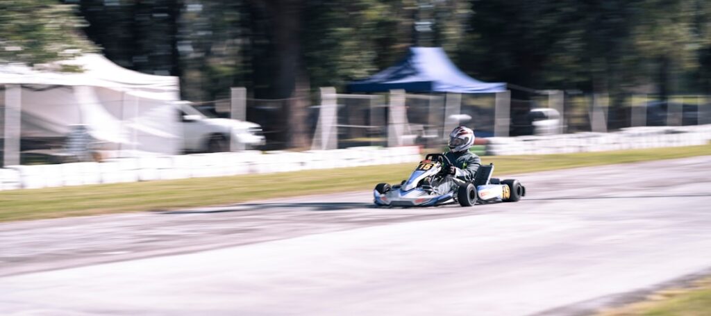 Robots Shatter Half-Marathon Records at Beijing Race a person driving a go kart