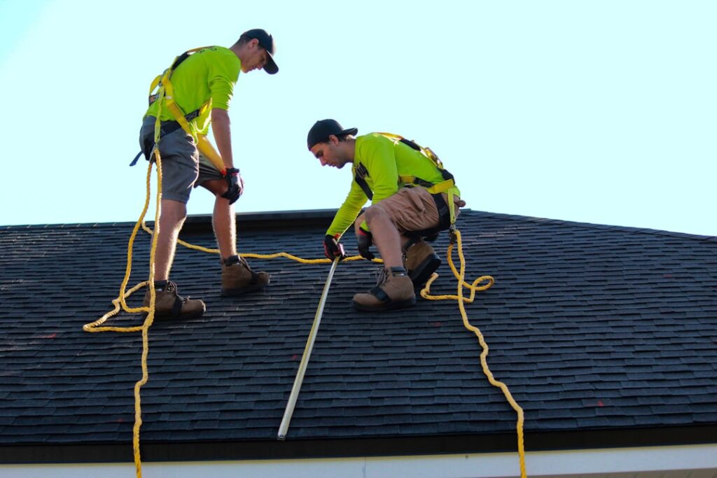 ROOFX Roofing Expands GAF Master Elite Services Across PA a couple of people that are on a roof