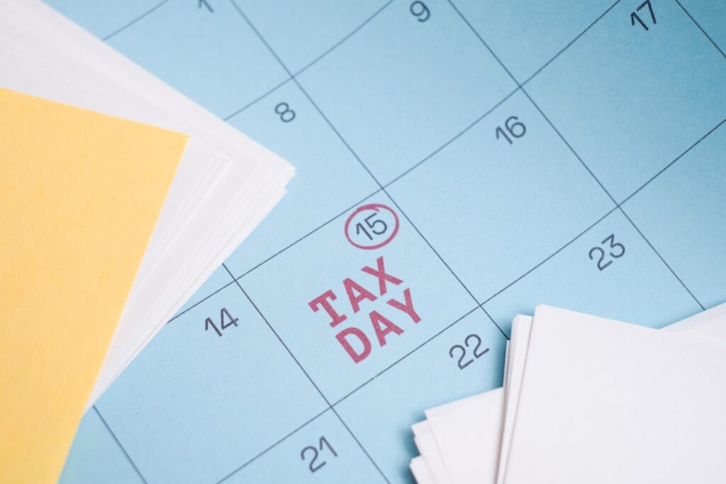 Small Business Tax Strategy Guide: 7 Essential Tips Calendar marked with "tax day" on the 15th.