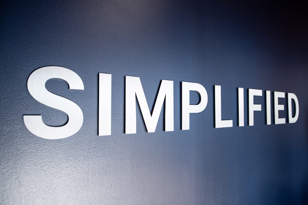 Snap Cuts 1,000 Jobs Following Activist Investor Pressure a close up of a sign on a wall
