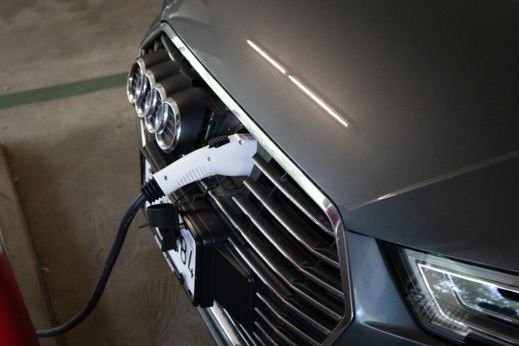 Tesla Q1 Revenue Surges on EV Sales and FSD Growth a car with a charging cable