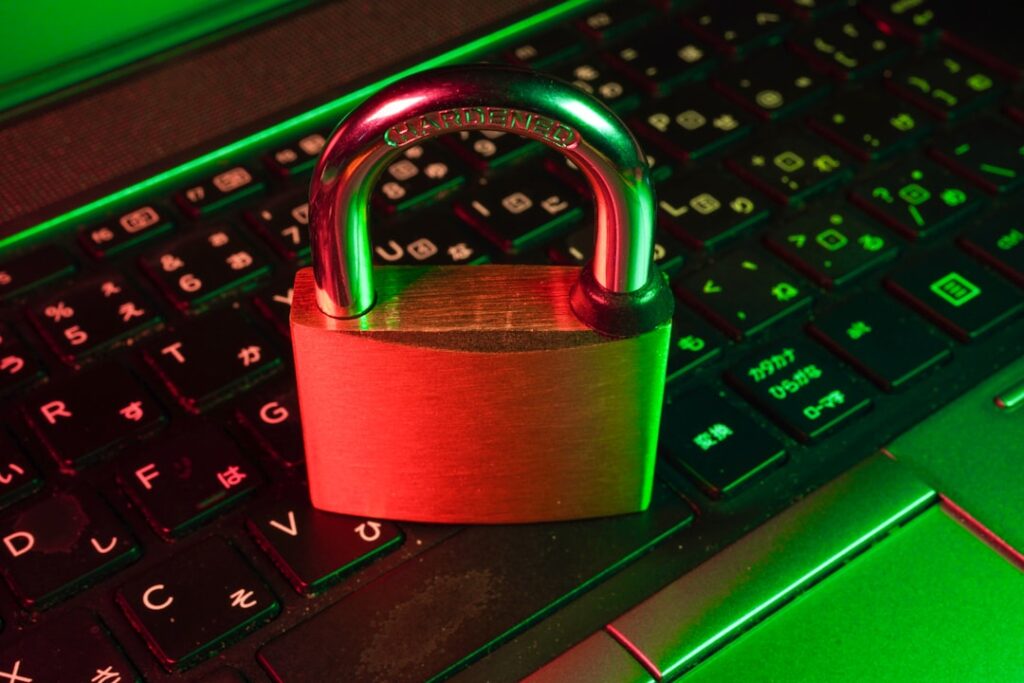 Two Americans Sentenced for North Korea IT Worker Scheme red padlock on black computer keyboard