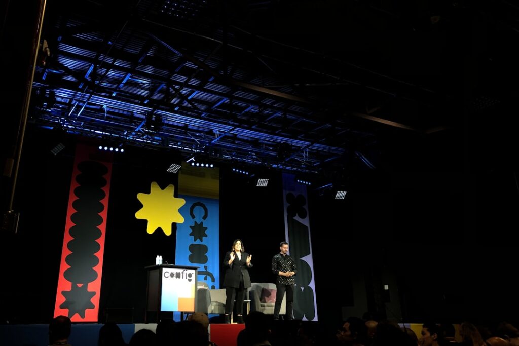 Uber CTO Joins StrictlyVC SF Lineup for April 30 people standing on stage with red yellow and blue star flag