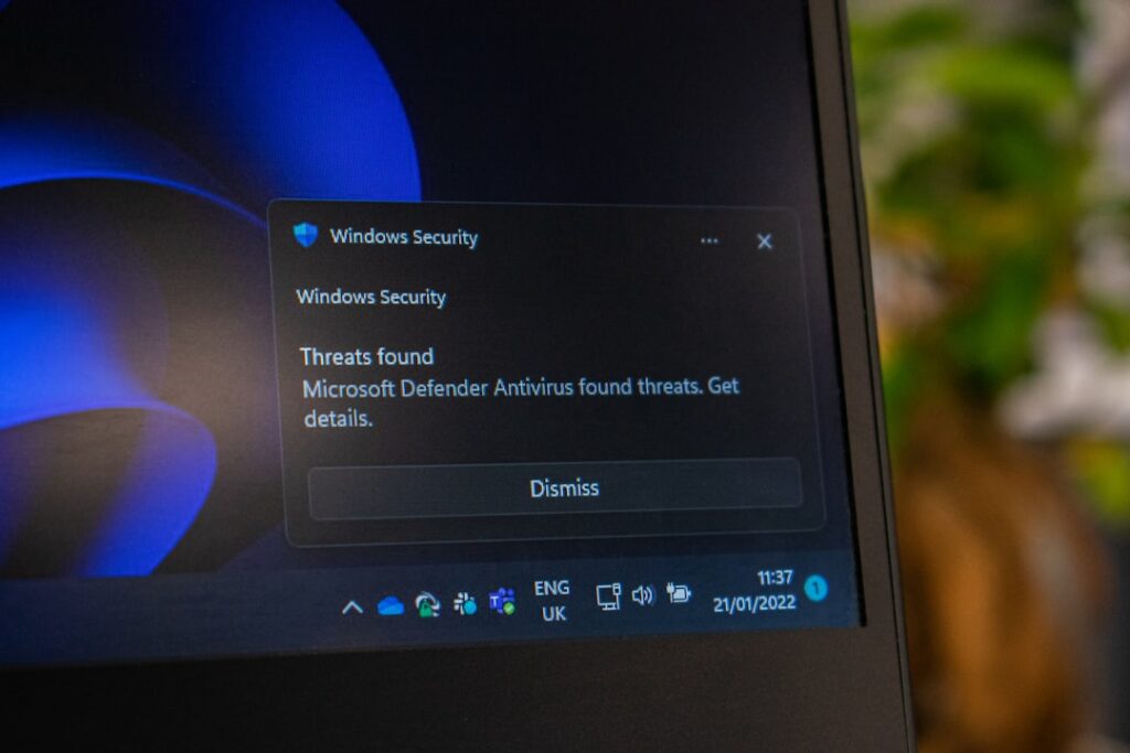 Windows Defender Flaws Exploited in Active Cyberattacks the screen of a laptop with the windows security button highlighted
