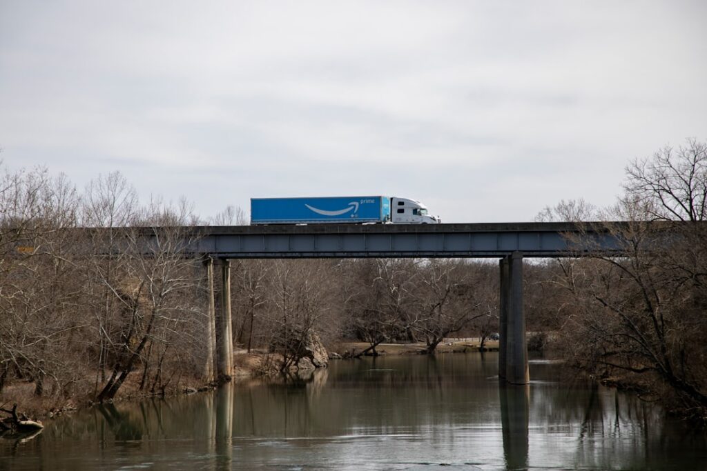 Amazon's UK Drone Delivery Service Takes Flight blue and white train on bridge during daytime