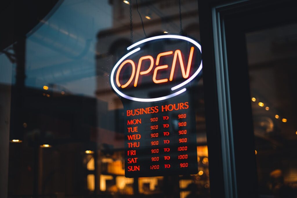 American Franchise Act Could Safeguard 9 Million Jobs a neon sign that says open in front of a window