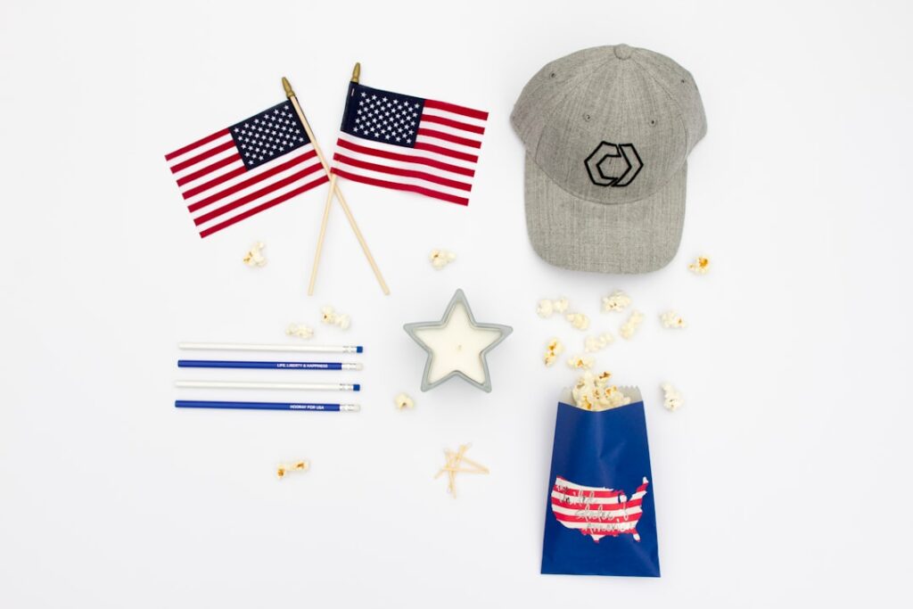 Brands Capitalize on America's 250th Birthday Celebration two U.S.A. flaglets with gray fitted cap and popcorn