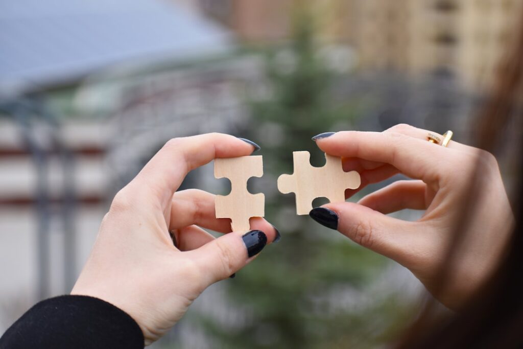 Divorced Couple Builds $1.4M Business Empire Together a few hands holding a small white object