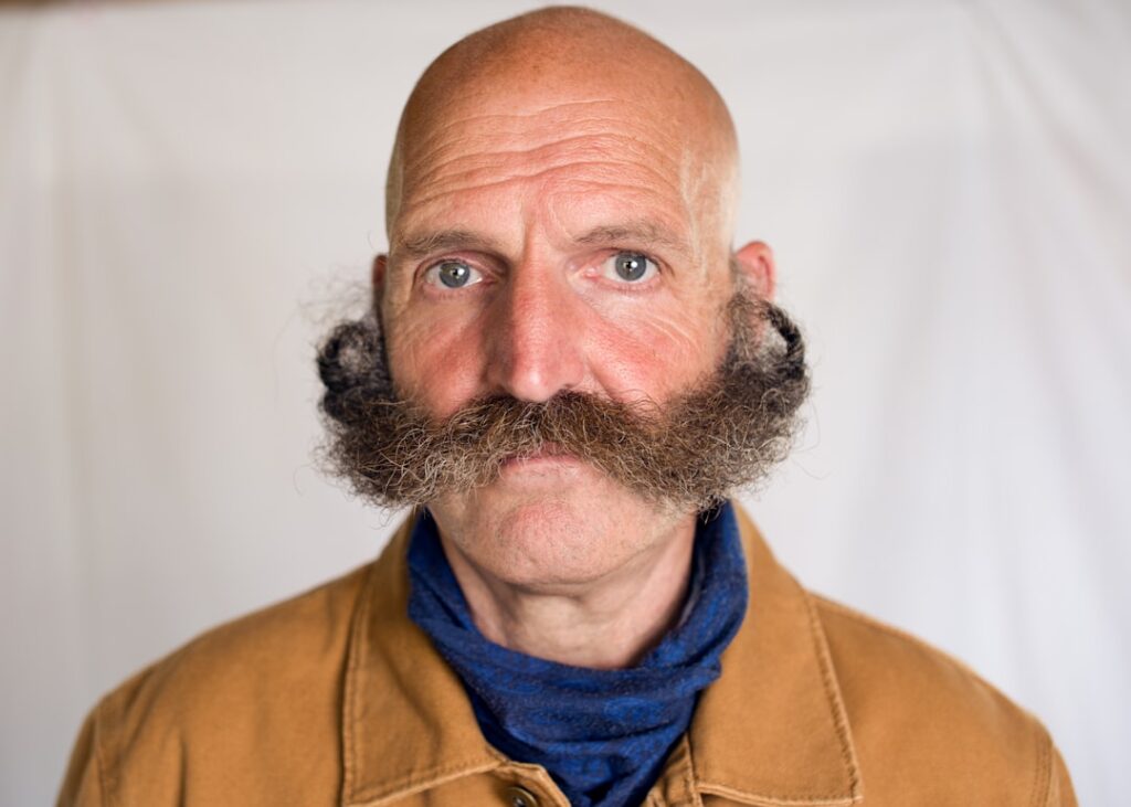 Fake Mustaches Defeat Age Verification Systems a man with a beard