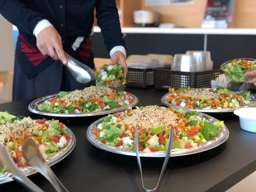 Food Franchises Capitalize on Corporate Meal Programs cooked food on table