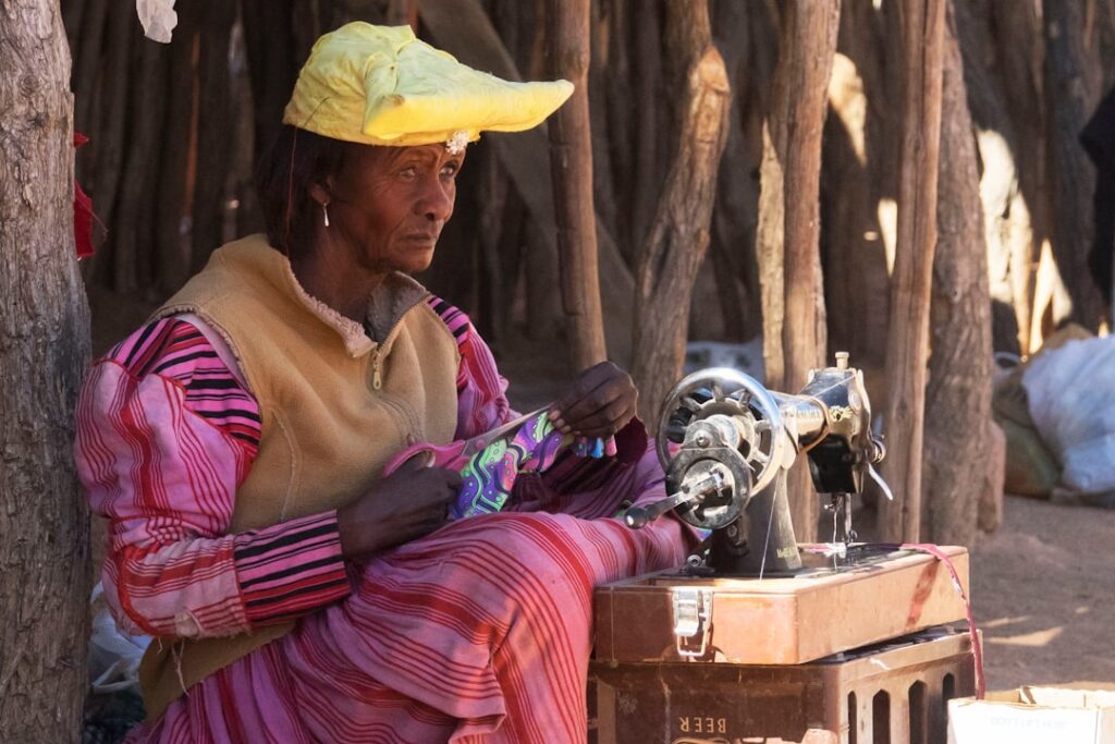 From Childhood Sewing Machine to $1M Business Woman sewing with a vintage sewing machine