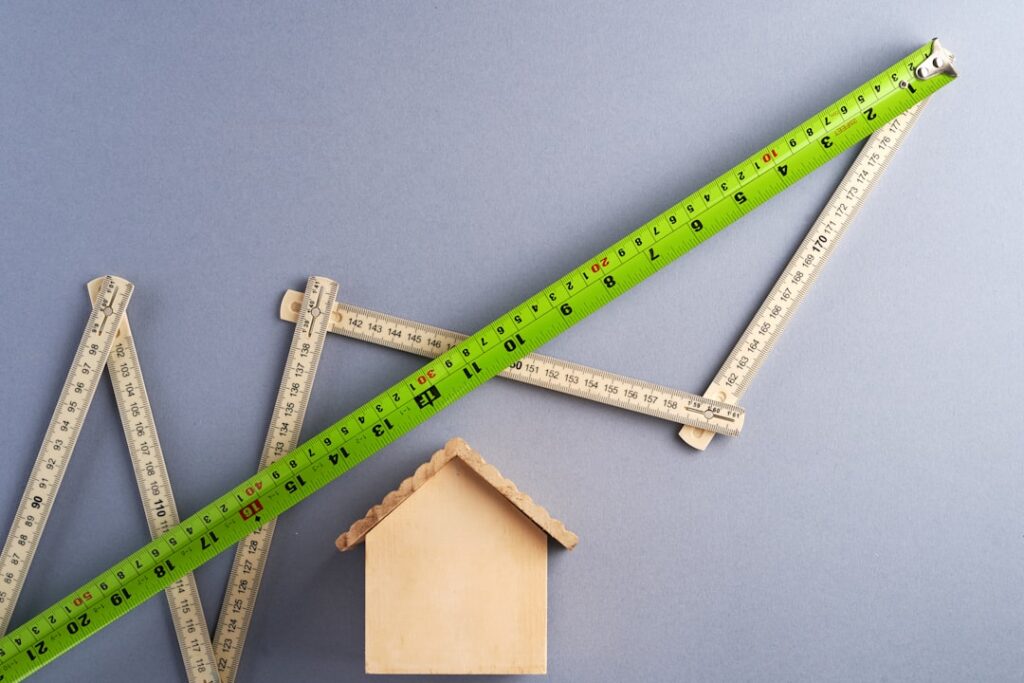 Home Valuation Myths Exposed by Mississippi Real Estate Expert green ruler on white surface