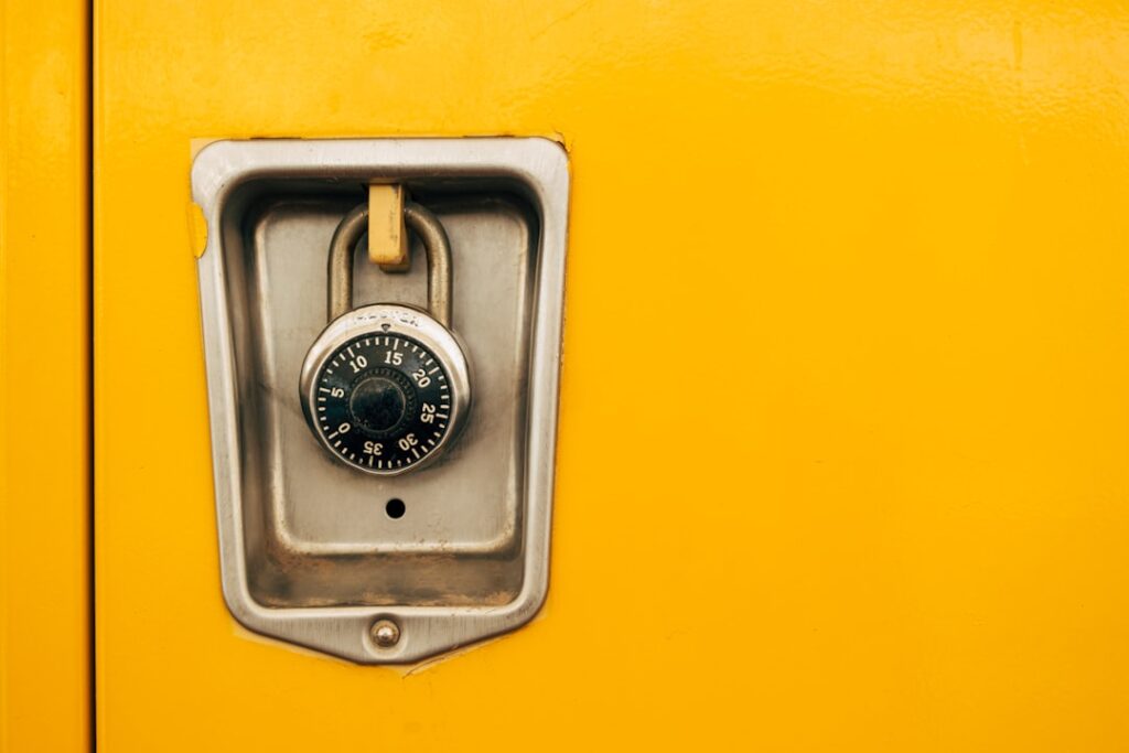 Instructure Hit Again as ShinyHunters Deface School Login Pages A close up of a lock on a yellow door
