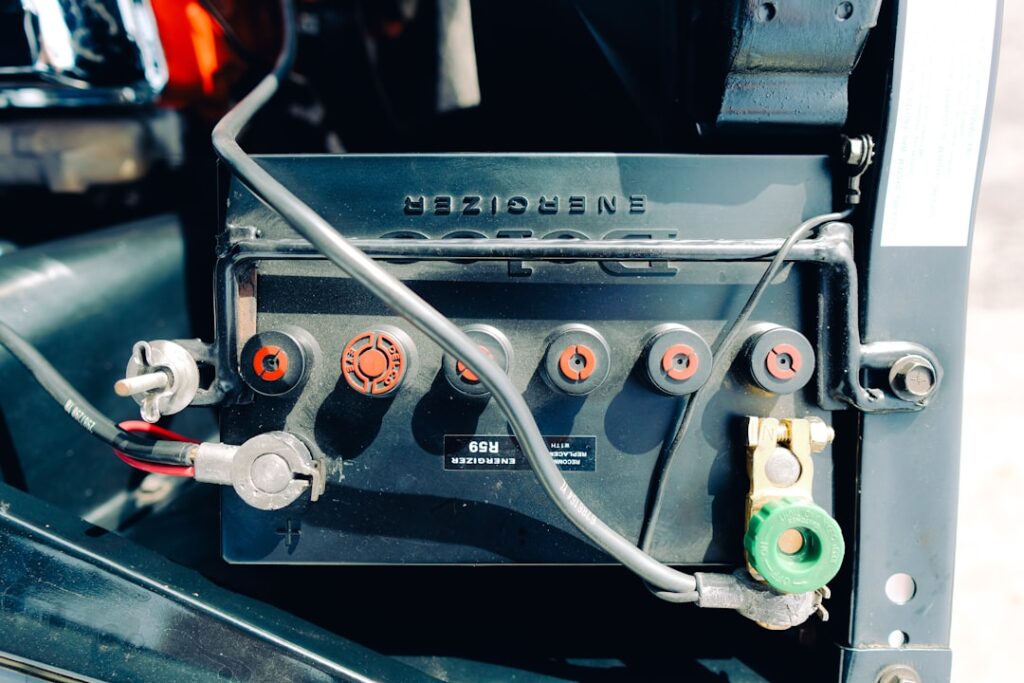 Microsoft's AI Expansion Threatens Clean Energy Commitments Close-up of a car battery with wires connected