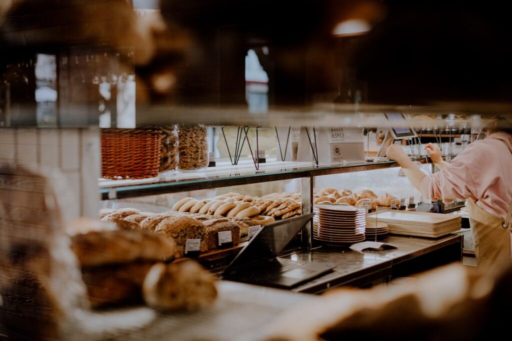 Morrisons Hit with £750k Fine for Systemic Bakery Failures a woman working in a bakery behind a counter