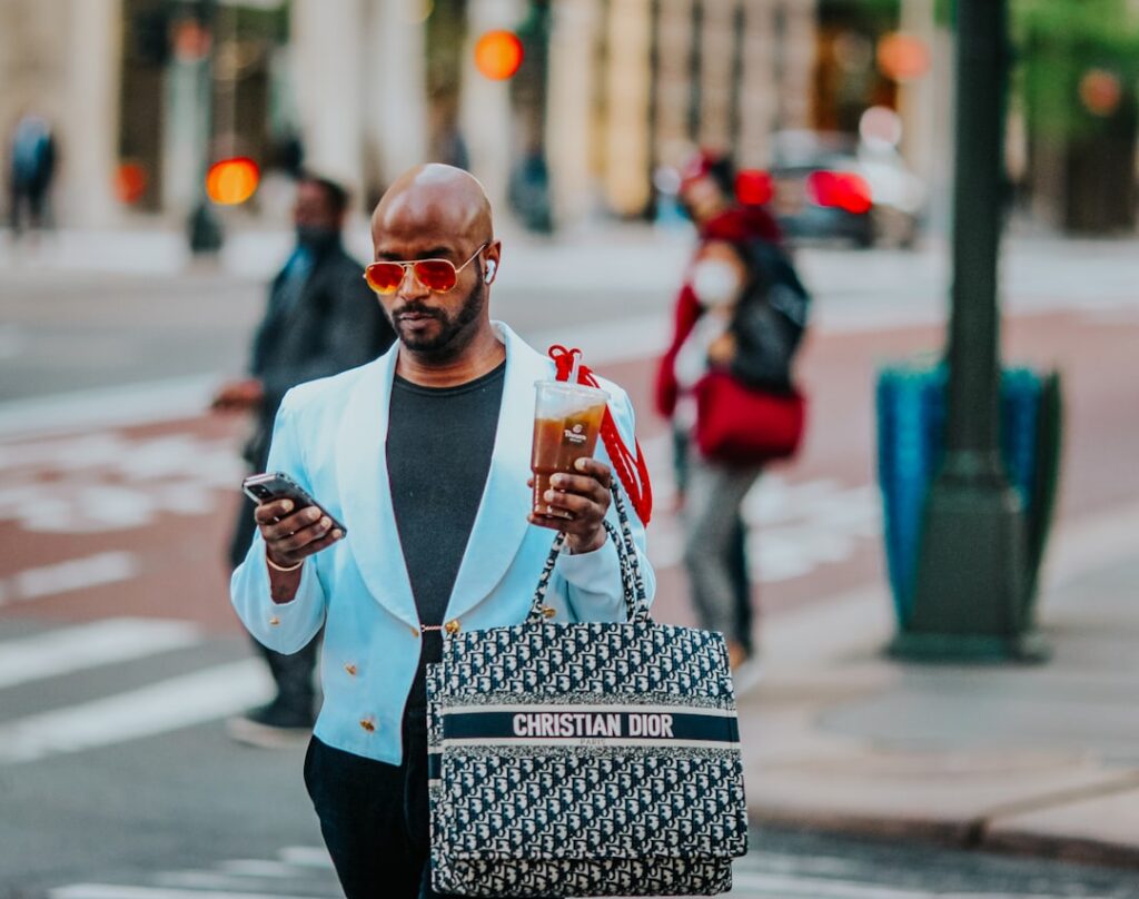 Mother-Daughter Fashion Brand Hits 7 Figures With iPhone Ads man in white long sleeve shirt holding white ceramic mug