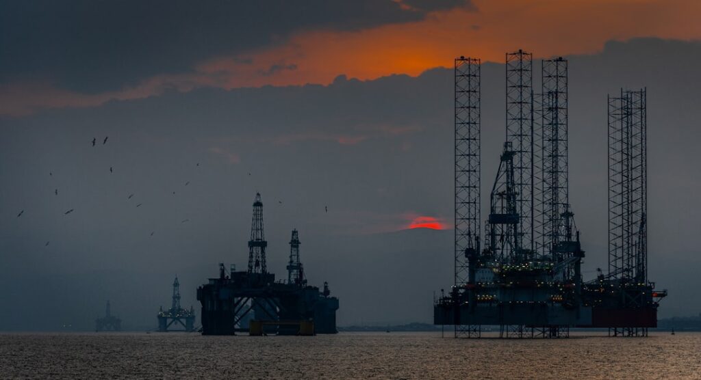 Oil Prices Surge After US-Iran Military Exchange in Hormuz a group of oil rigs in the ocean