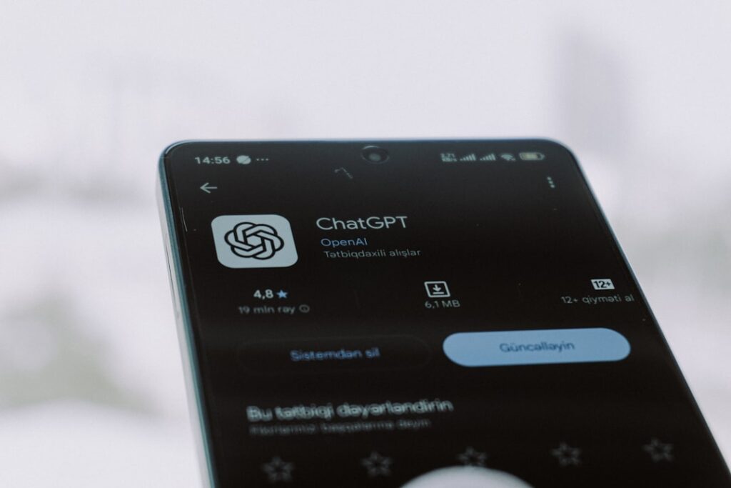 OpenAI's AI Phone Could Reshape Mobile Computing The image shows the chatgpt app on a phone.