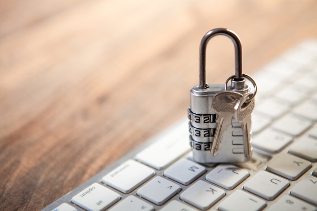 Password Security Crisis: Why U.S. Firms Are Most Vulnerable Padlock and keys resting on a computer keyboard.