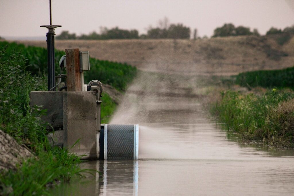 Poland Water Plants Hacked: US Infrastructure Under Siege A truck driving down a flooded road