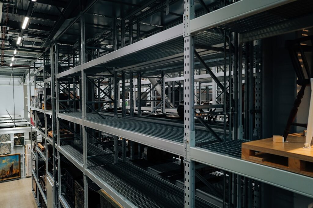 Russel Metals Crushes Q1 2026 With Record Revenue Industrial shelving units with various items stored
