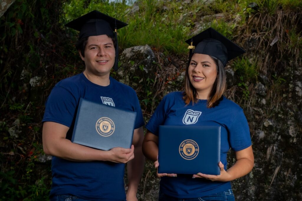 Salesforce Recruits 1,000 AI-Native Graduates Amid Job Market Shift man in blue crew neck t-shirt standing beside woman in black academic dress