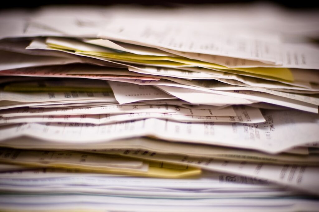 Small Business Accounting 101: Essential Guide for Owners A close-up of a stack of papers.