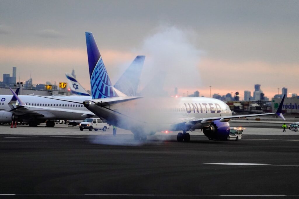 Spirit Airlines Collapse: Bondholders Reject Bailout, Ground Fleet an airplane is on the runway with a lot of smoke coming out of it