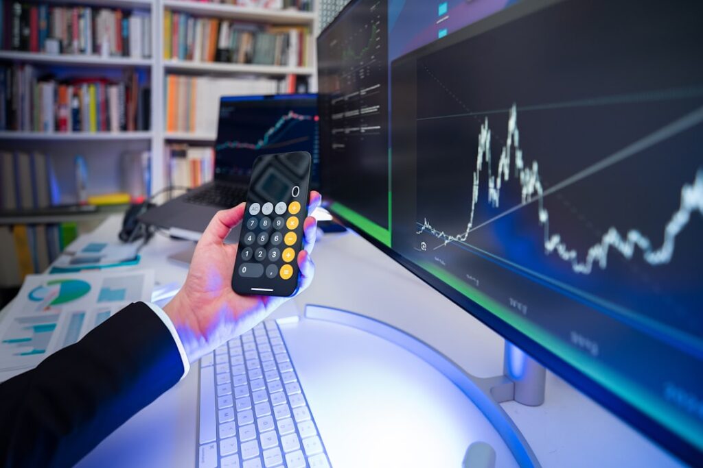 Sun Life Boosts Dividend Payouts for Q2 2026 A man holding a remote control in front of a computer