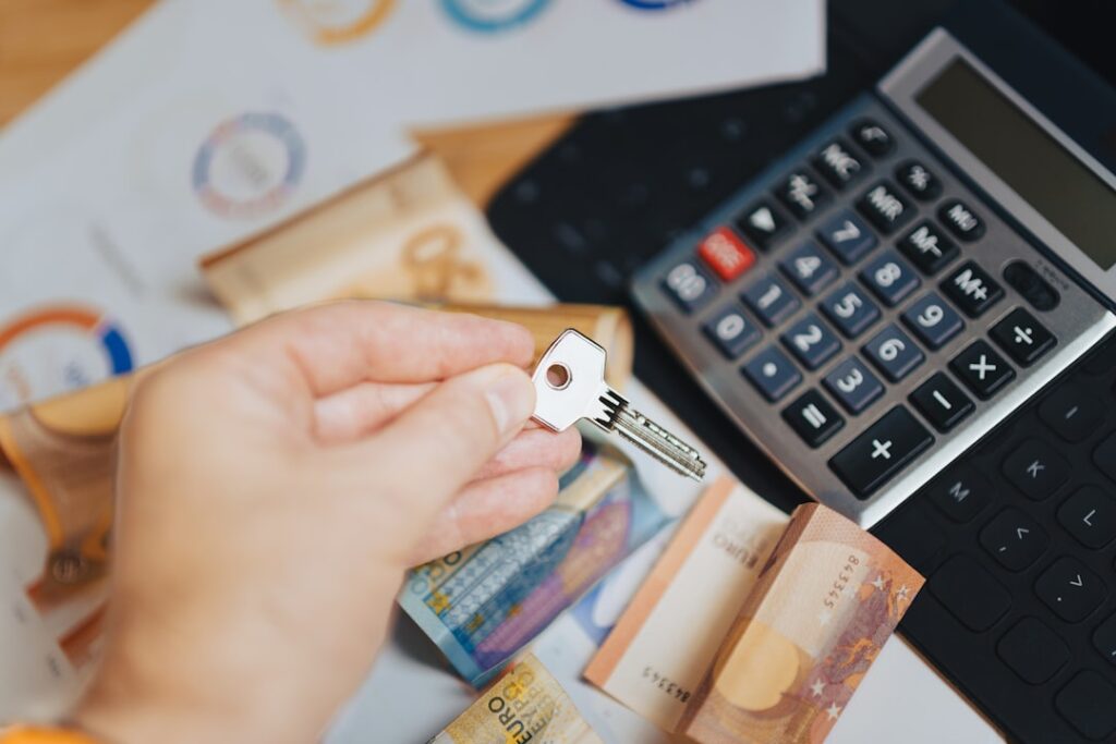 Term Financing Explained: A Complete Guide for Business Growth A person is putting money in front of a calculator