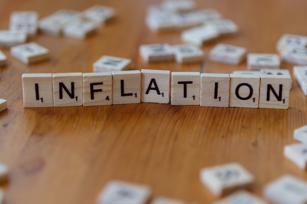Trump's Economic Legacy: What Voters Really Care About Inflation is spelled out using scrabble tiles.