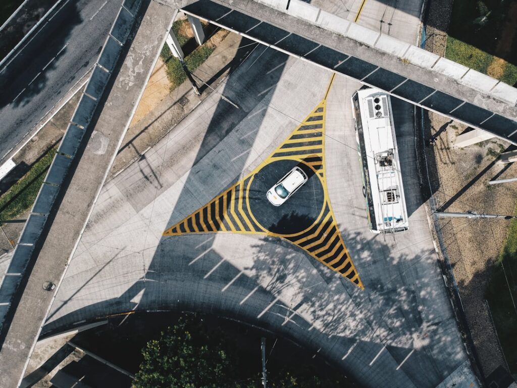 Uber's Audacious Plan to Weaponize Its Driver Network aerial view of gray and yellow concrete building