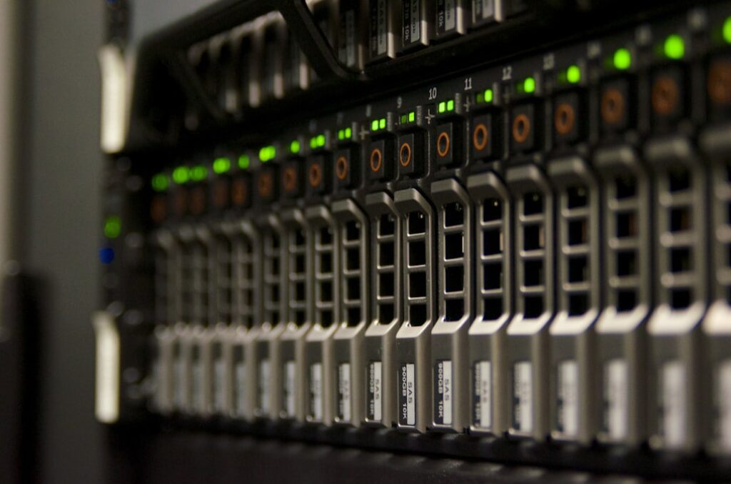 xAI's Data Center Empire: The Cloud Computing Pivot Server rack with blinking green lights